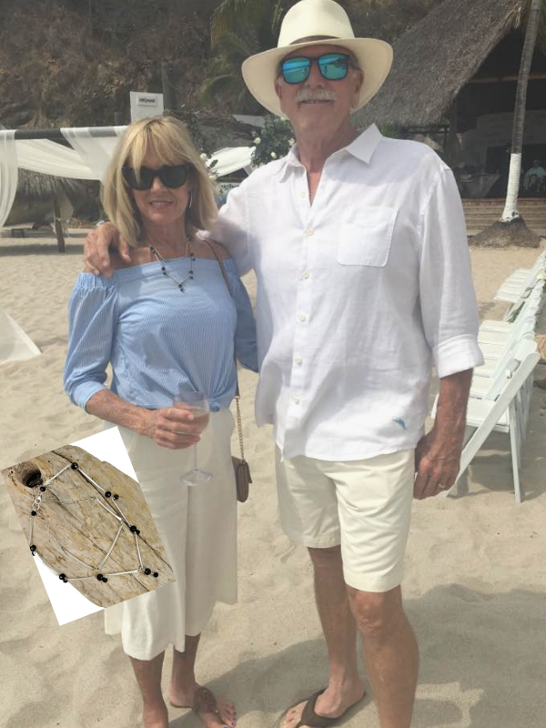 couple on the beach and necklace